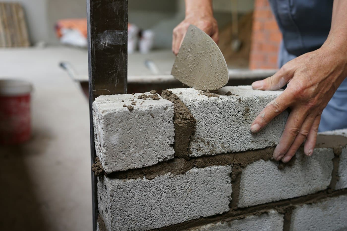 Mason building a block wall
