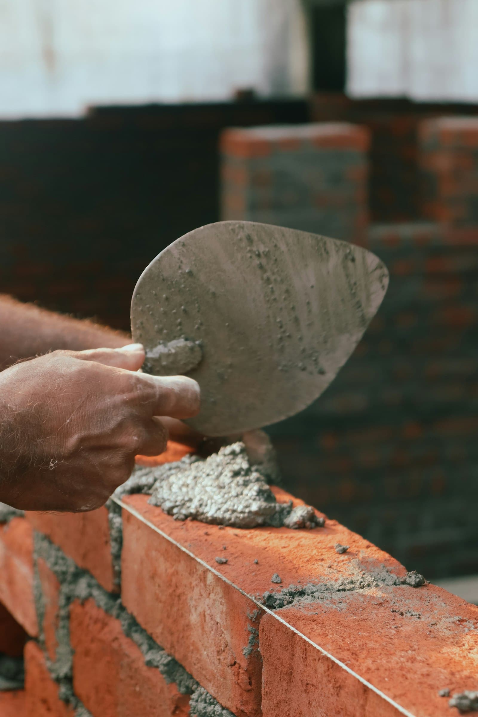 Fresh mortar being spread for masonry work